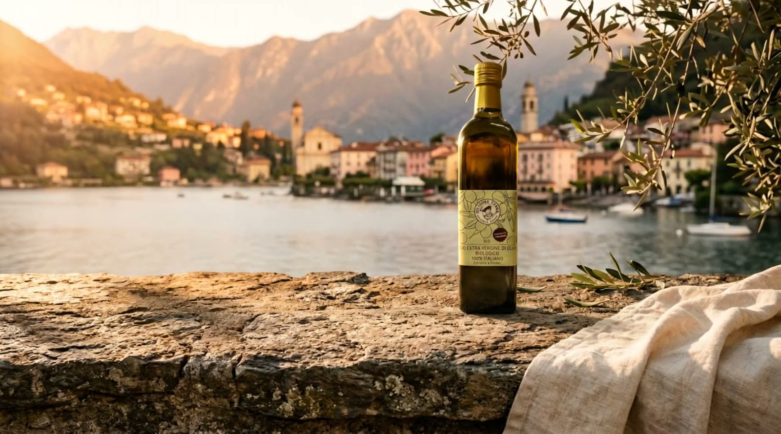 Italian olive oil, pasta and passata on a stone terrace by a lake, in golden light.